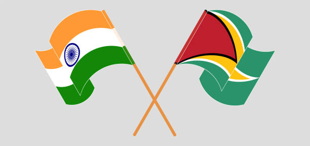 istock Crossed and waving flags of India and Guyana 1327811630