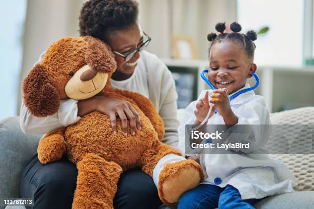 Shot Of An Adorable Little Girl And Her Mother Playing With A Stethoscope In The Waiting Room Of A Doctors Office Stock Photo - Download Image Now