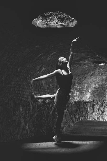 istock Ballerina practicing in a dark tunnel 1327814351