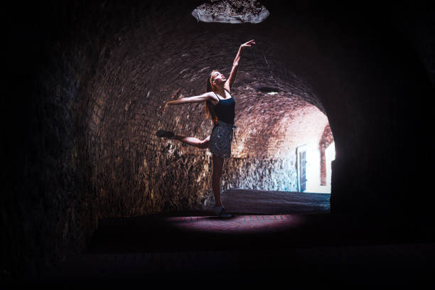 istock Ballerina practicing in a dark tunnel 1327814570