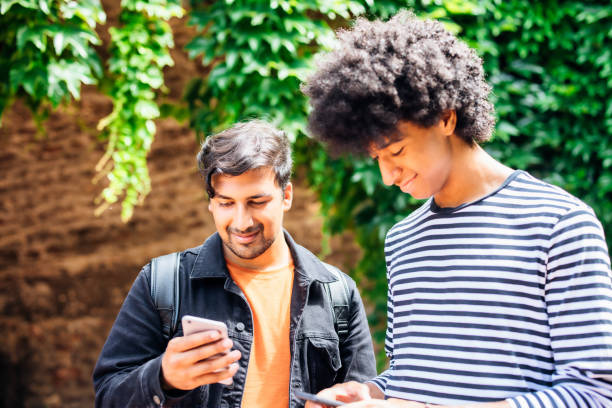 istock Friends using smartphone to check the social media 1327815193