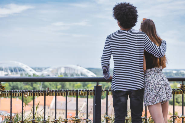 istock Friends visiting admiring the cityscape from vantage point 1327815320