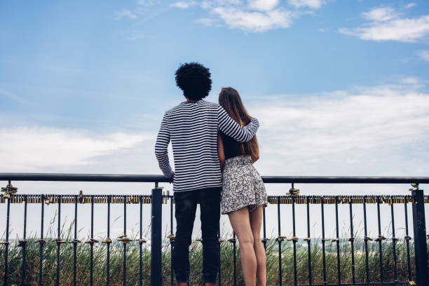 istock Friends visiting admiring the cityscape from vantage point 1327815532
