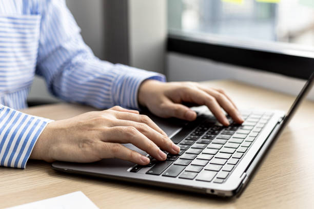 istock Hands of businesswoman typing on a laptop keyboard, she is using a messaging program to talk to a business partner who is opening a startup company. Concept of using technology in communication. 1327816198