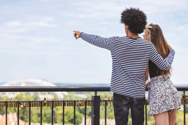 istock Friends visiting admiring the cityscape from vantage point 1327816518