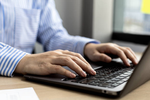 istock Hands of businesswoman typing on a laptop keyboard, she is using a messaging program to talk to a business partner who is opening a startup company. Concept of using technology in communication. 1327816571