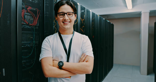 istock Shot of a young man standing in server room 1327817688