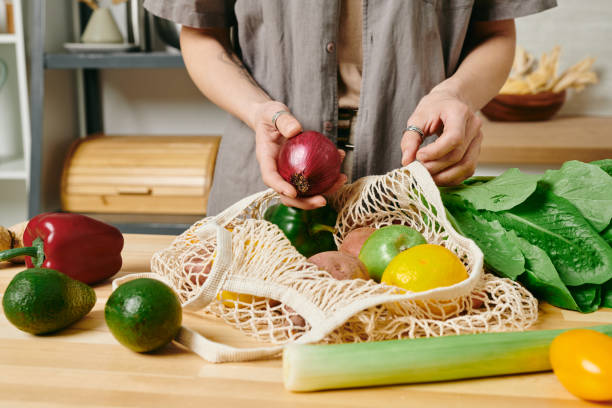 istock Young housewife preparing fresh vegetables for stew 1327817851