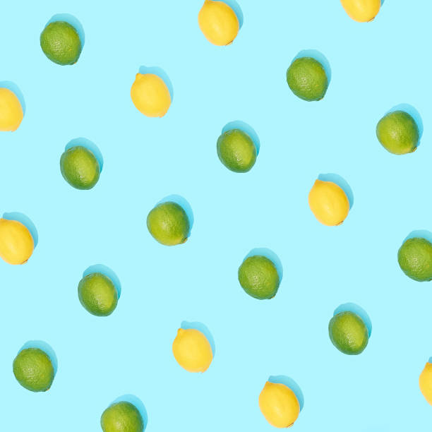 istock Fresh limes and lemons on blue background. 1327819570