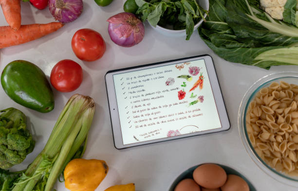 istock Following an online recipe while cooking 1327819814