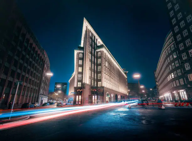 Street in downtown Hamburg and Chilehaus building at night- Hamburg, Germany