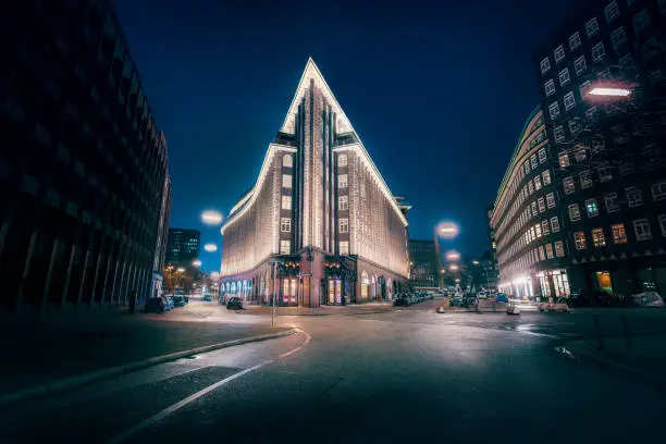 Street in downtown Hamburg and Chilehaus building at night- Hamburg, Germany
