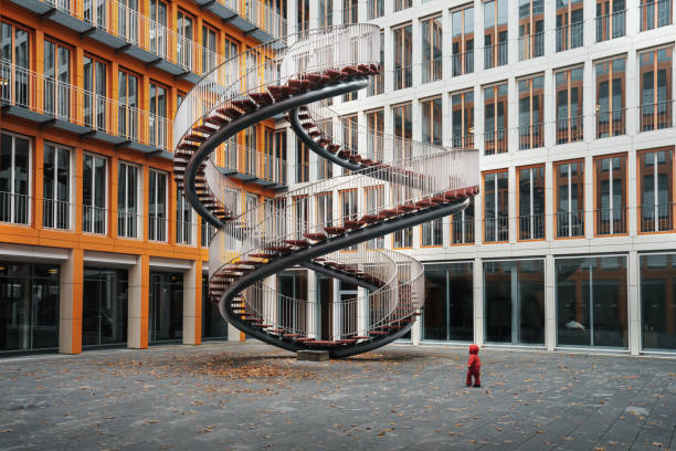 Munich, Germany - Nov 01, 2019: Umschreibung sculpture also called the endless staircase - Work by Olafur Eliasson, 2004 - permanent installation in front of KPMG offices - Munich, Bavaria, Germany