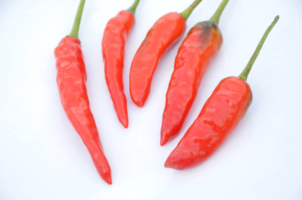 istock bunch the red ripe chilly isolated on white background. 1327822808