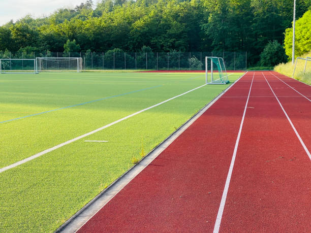 istock Running track and a soccer field 1327823553