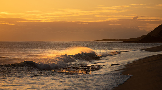 Sunset waves at Keawaula Beach in Hawaii