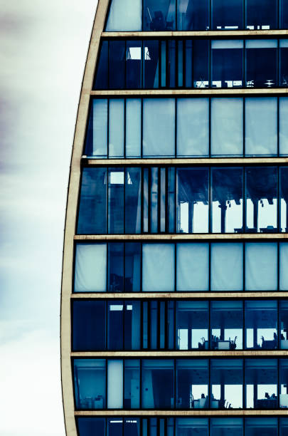 istock Generic commercial office building with office equipment as viewed from outside 1327832727