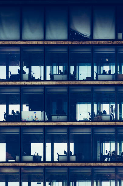 istock Generic commercial office building with office equipment as viewed from outside 1327832759