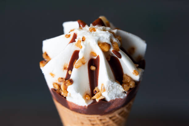 istock Cream and chocolate ice cream cone 1327835678