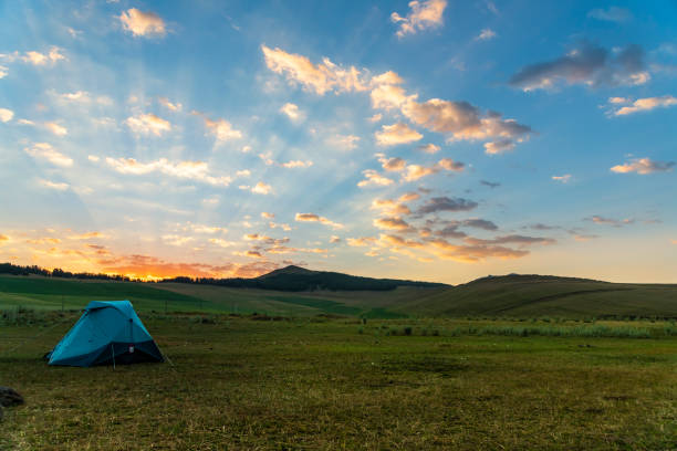 istock Camping in Meadow at Sunrise 1327836332