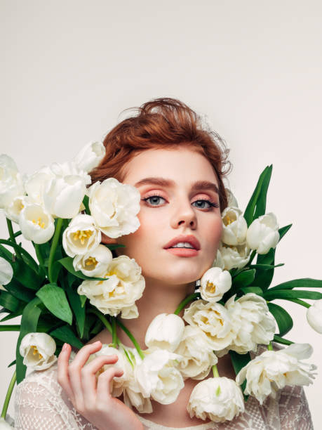 istock Beautiful girl with tulips 1327838629
