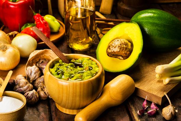 istock Guacamole and ingredients in a rustic wood table 1327841241