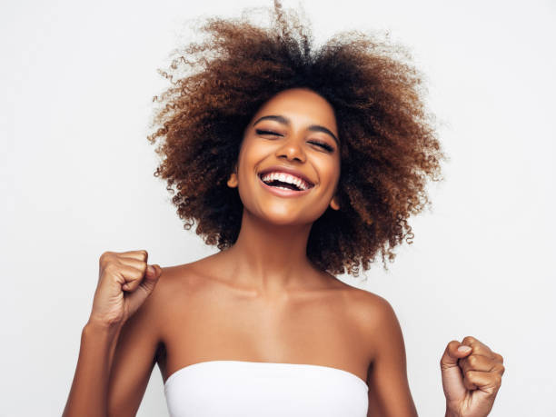 istock Beautiful smiling girl with curly hairstyle 1327841494