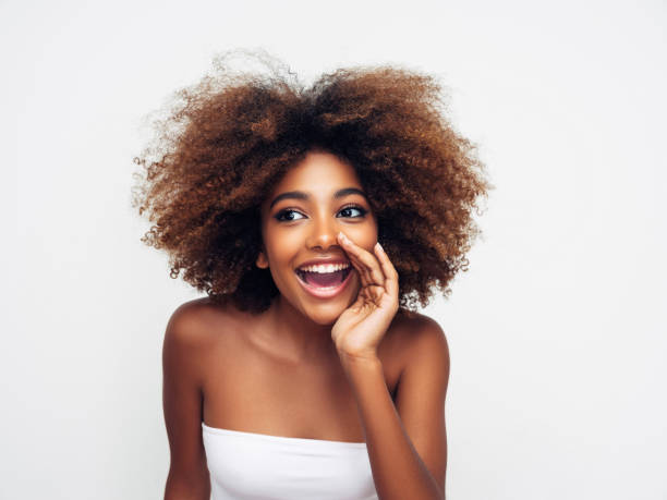 istock Beautiful smiling girl with curly hairstyle 1327841525