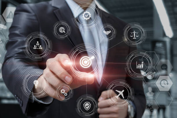 istock Businessman plans his goals on a virtual computer. 1327844176