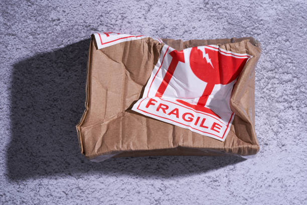 istock damaged parcel with fragile sticker on the floor 1327851607