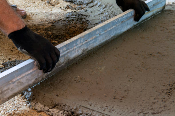 istock A worker levels the concrete floors along the lighthouses using a wire. 1327861905