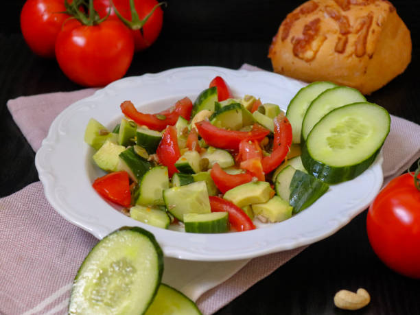 istock Cucumber tomato avocado salad 1327865602