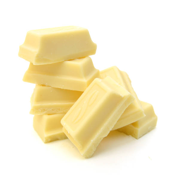 istock White chocolate pieces isolated on a white background 1327865671