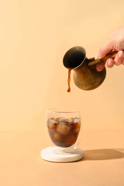 istock Iced latte coffee in cup glass with pouring milk 1327871420