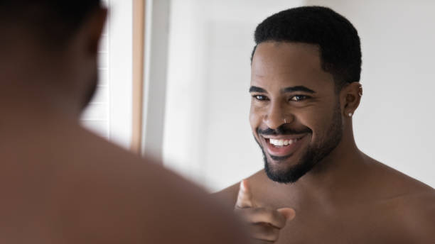 istock Happy handsome Black metrosexual guy with facial piercing 1327874254