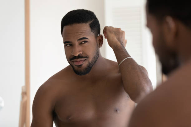 istock Handsome young mixed race Black man with bare muscular torso 1327874635