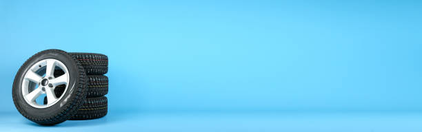 istock set of winter studded wheels are on a blue background 1327874806