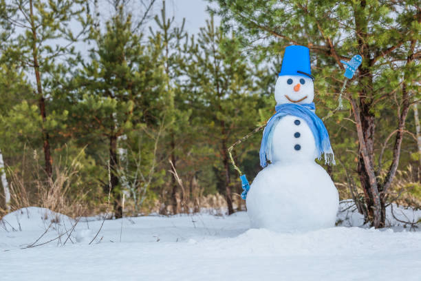 istock snowman wearing scarf 1327875010