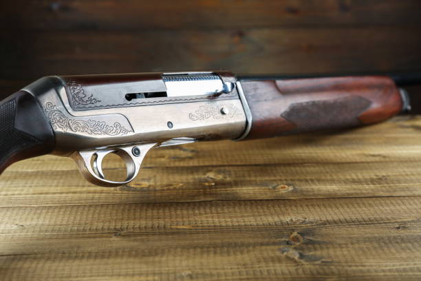 istock hunting rifle on a wooden background 1327875045