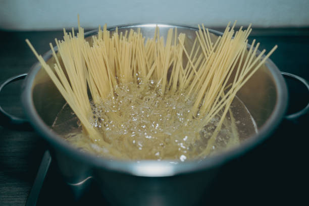 istock Cooking noodle in hot water 1327876632