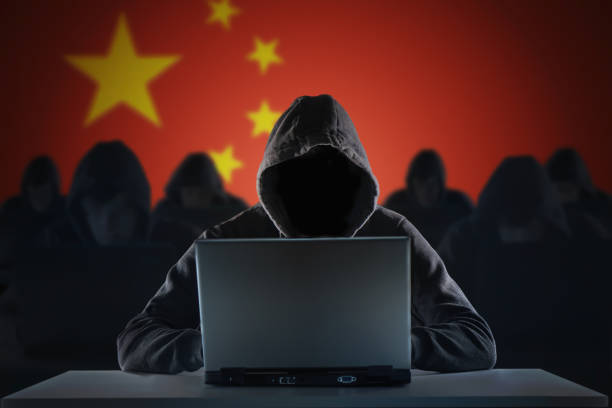 Many chinese hackers in troll farm. Privacy and security concept. stock photo