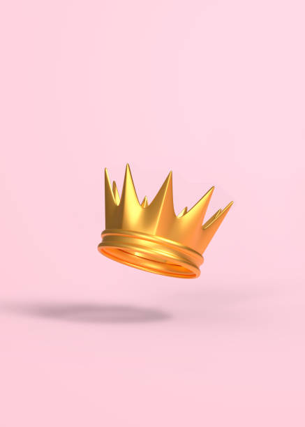 istock Golden crown flies on a pink background 1327878958