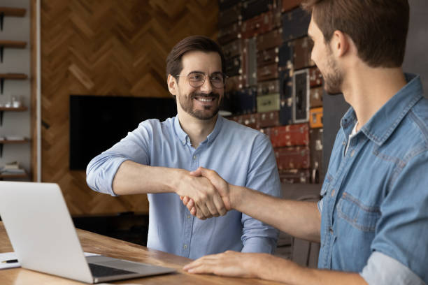 istock Happy businessman handshaking, making agreement with partner. 1327880437