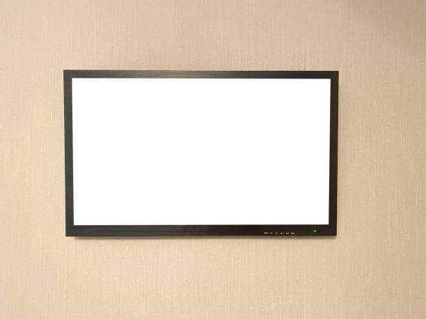 istock Black TV hanging on the wall close-up with mockup 1327883935