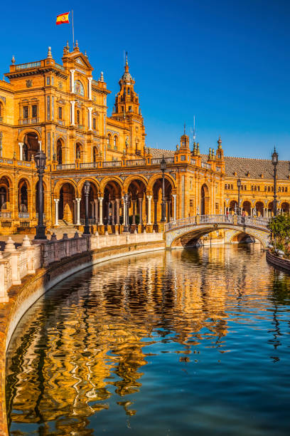 Plaza de Espana Square Reflection Seville Spain Plaza de Espana Spain Square Towers Reflection Seville Andalusia Spain.  Built in 1928 for Ibero American Exposition in Maria Luisa Park historical geopolitical location stock pictures, royalty-free photos & images
