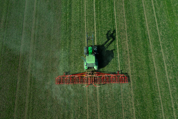 istock Agricultural Tractor in Field 1327891907