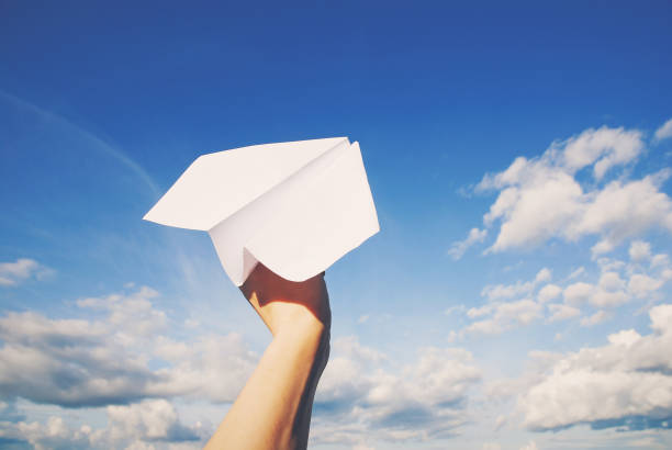istock paper plane in hand ready to fly 1327892455