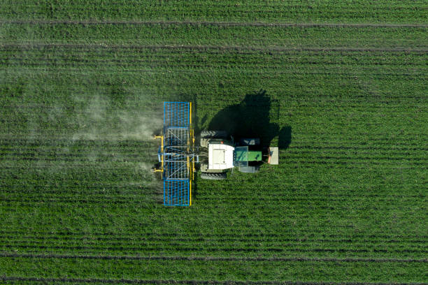 istock Agricultural Tractor Working in Field 1327892502