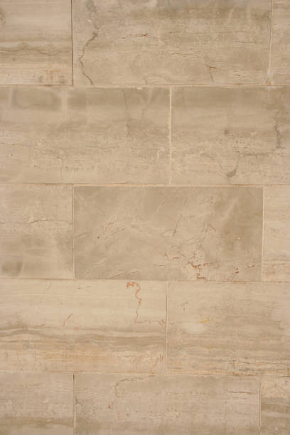istock Pattern of Modern stone Brick Wall Surfaced for background.  Beige Plastered Concrete Wall Background Texture Detail. Beige and brown brick stone wall texture, stone wall background 1327896420