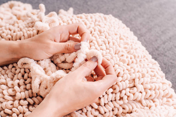 istock Knits made from thick soft yarn. Soft knitted cushions made of thick yarn. 1327896637